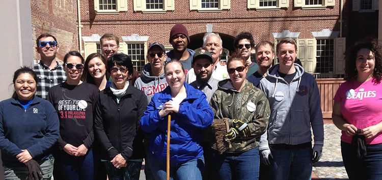 Jeremy in a group of people Volunteering with FINHP